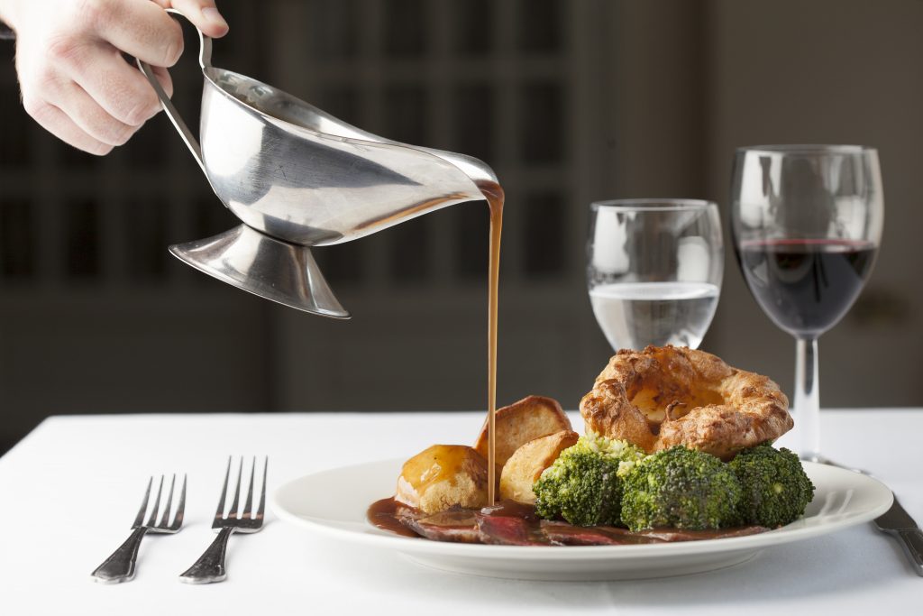 gravy pouring on sunday roast 